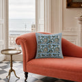 Sky Blue Lotus Vine Cushion Cover, styled in a seating or bedroom setting.