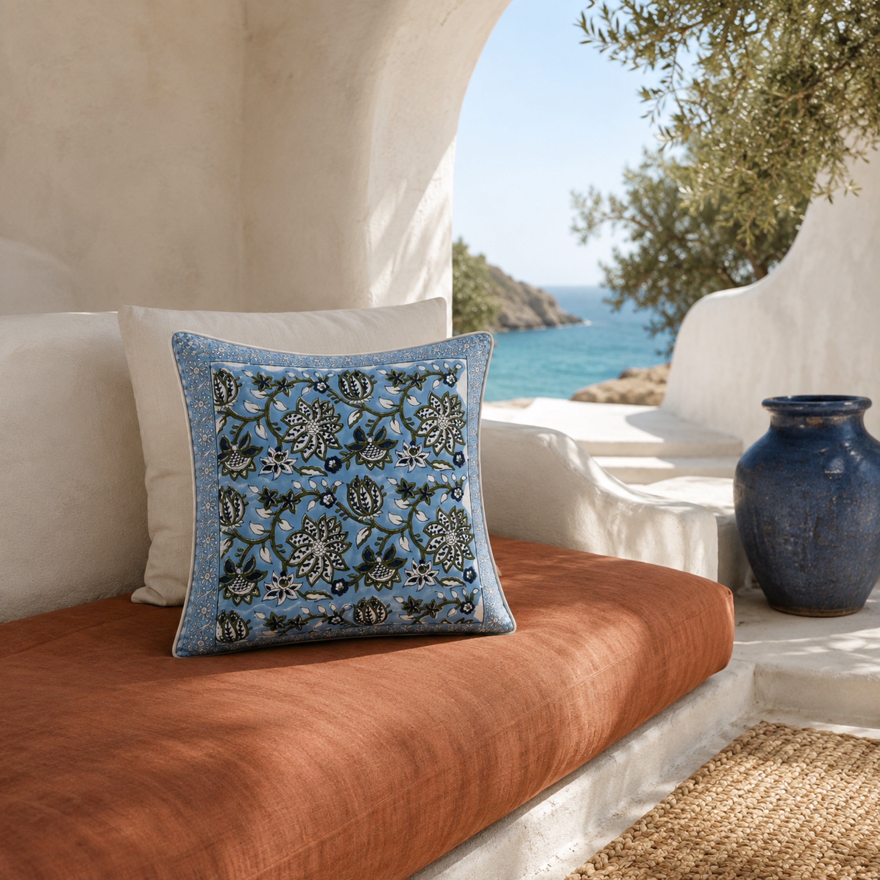Sky Blue Lotus Vine Cushion Cover, styled in a seating or bedroom setting.