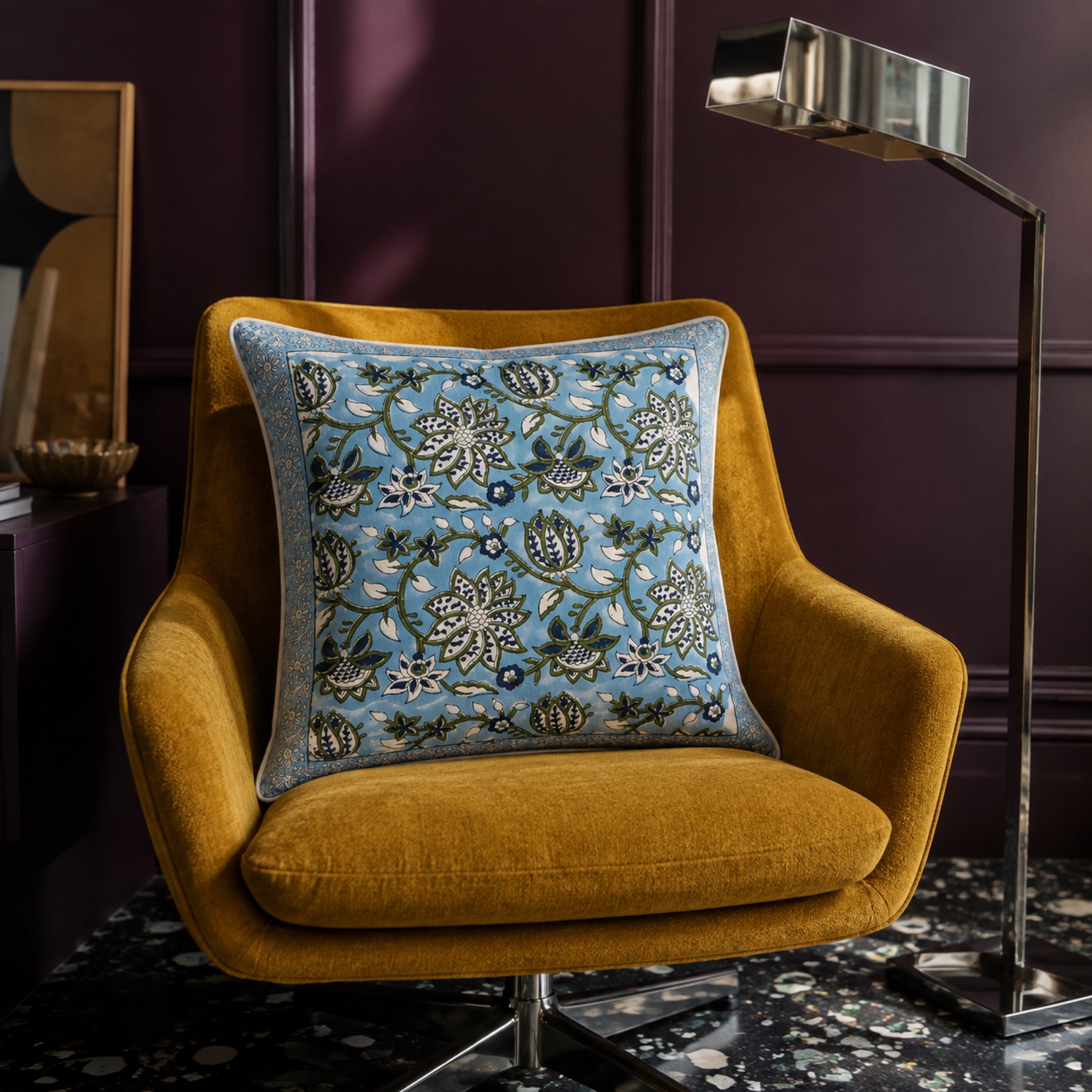 Sky Blue Lotus Vine Cushion Cover, styled in a seating or bedroom setting.