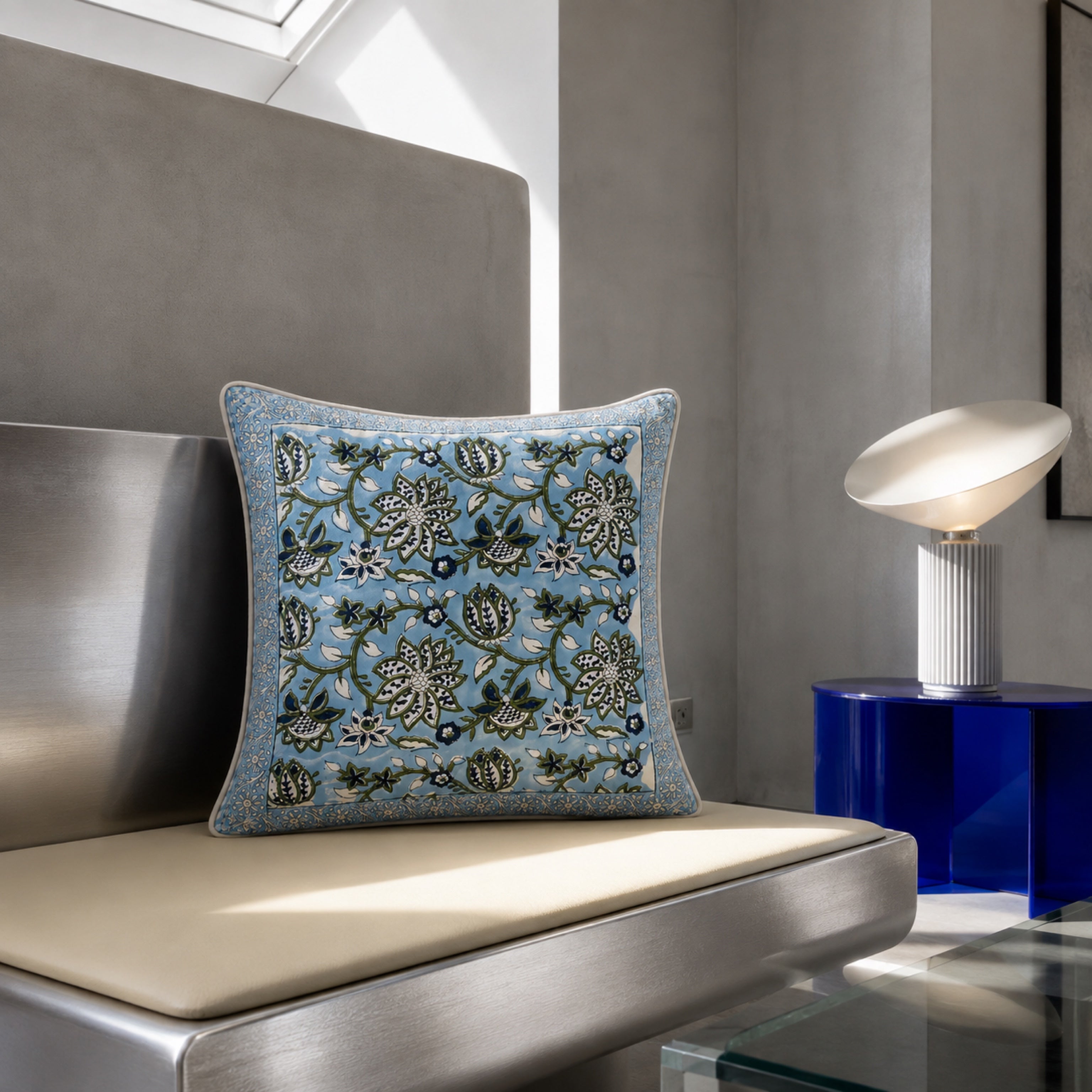 Sky Blue Lotus Vine Cushion Cover, styled in a seating or bedroom setting.