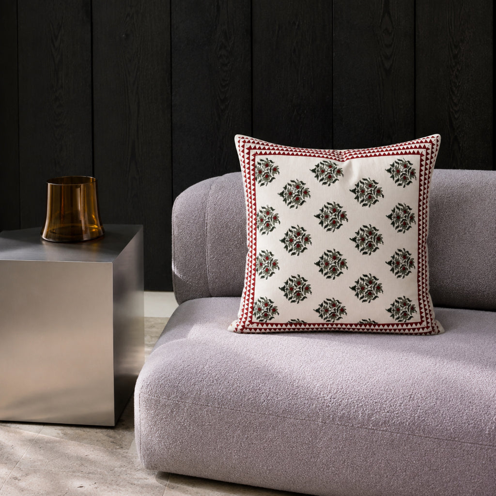Red Berry Sprig Cushion Cover, styled in a seating or bedroom setting.