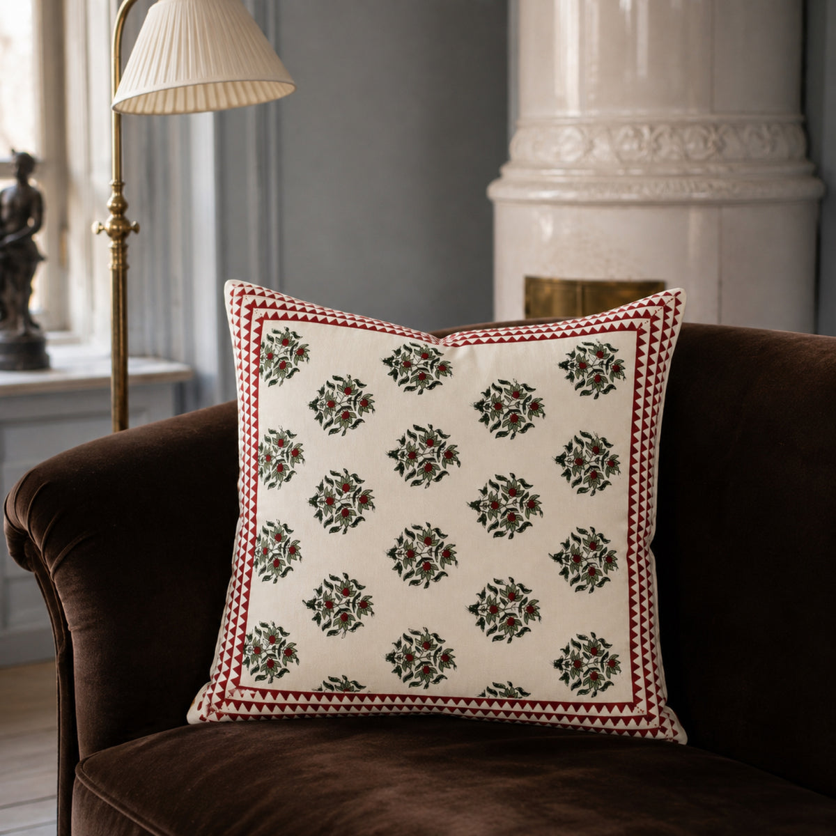 Red Berry Sprig Cushion Cover, styled in a seating or bedroom setting.