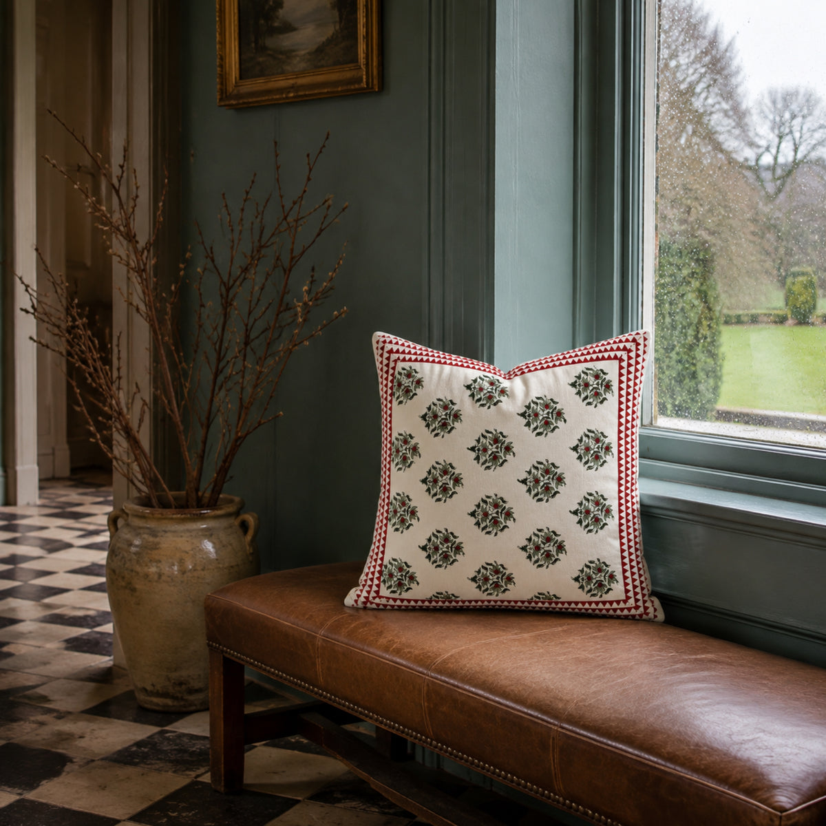 Red Berry Sprig Cushion Cover, styled in a seating or bedroom setting.