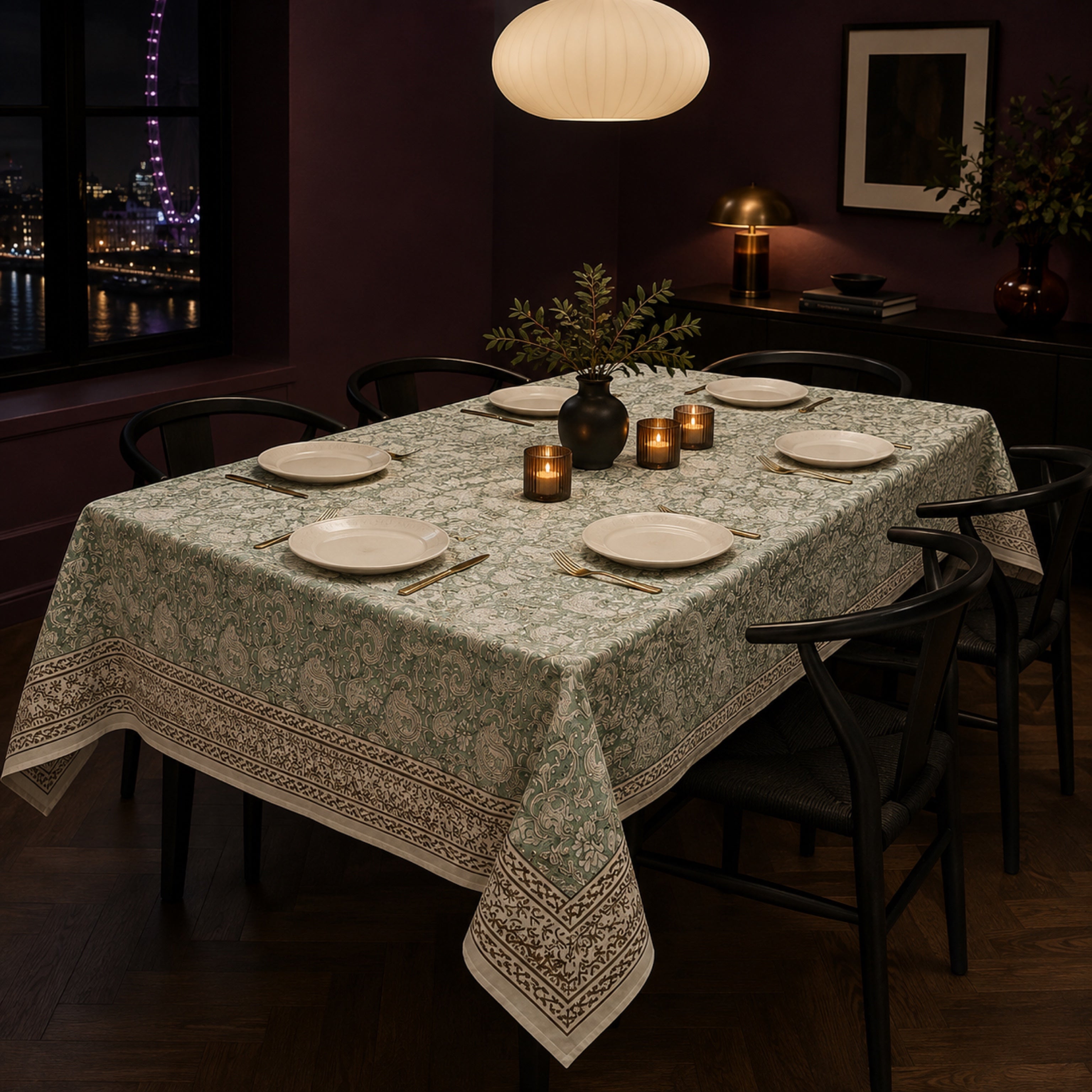 Sage Paisley Border Table Cover, styled on a dining table.