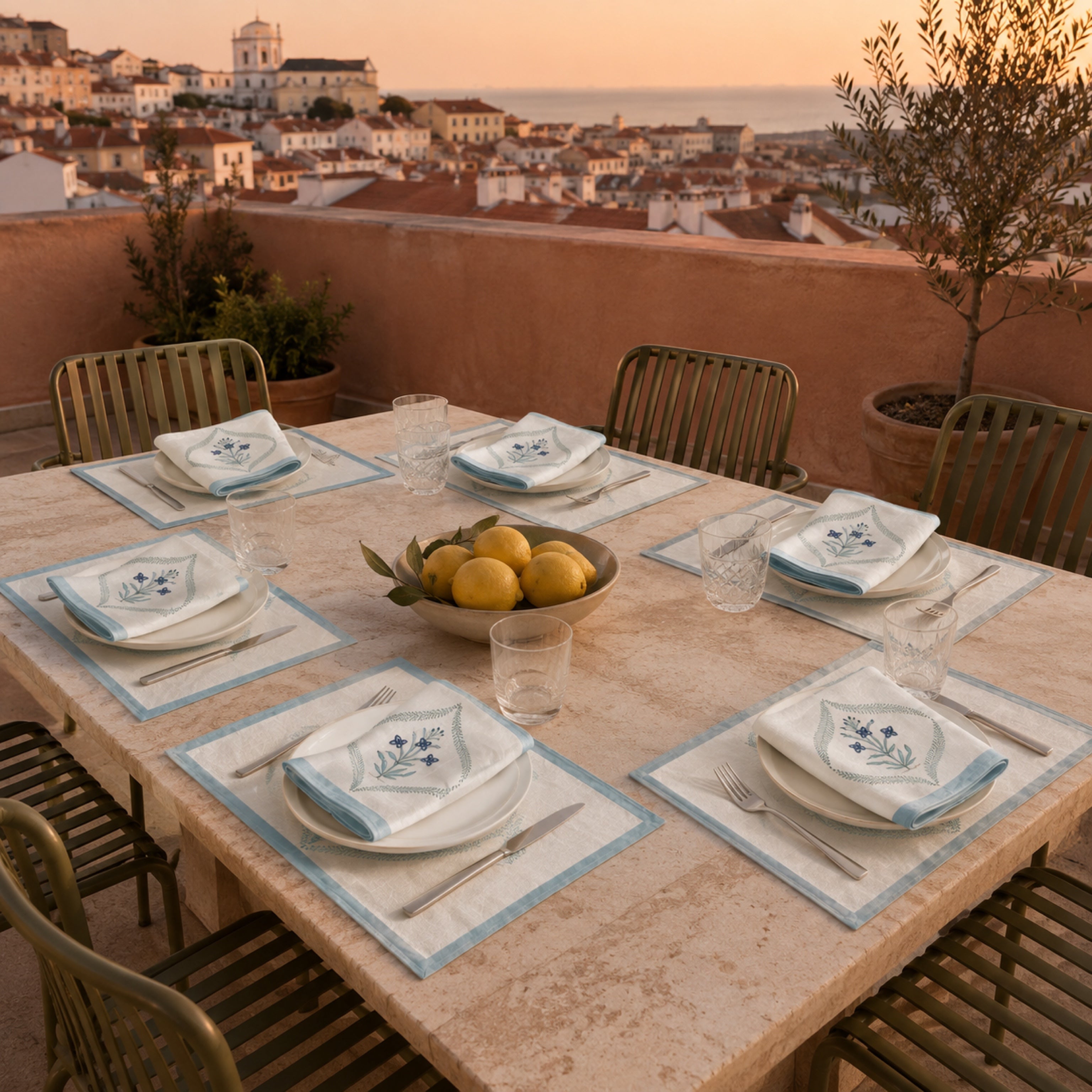 Powder Blue Botanical Wreath Mat & Napkin Set, styled on a dining table.