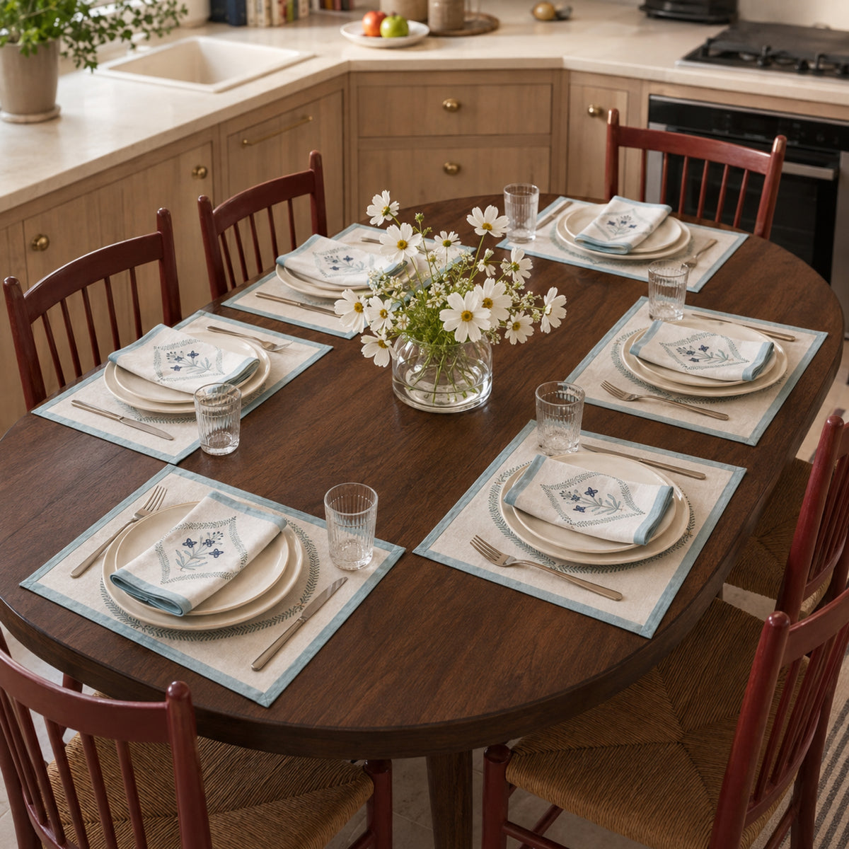 Powder Blue Botanical Wreath Mat & Napkin Set, styled on a dining table.