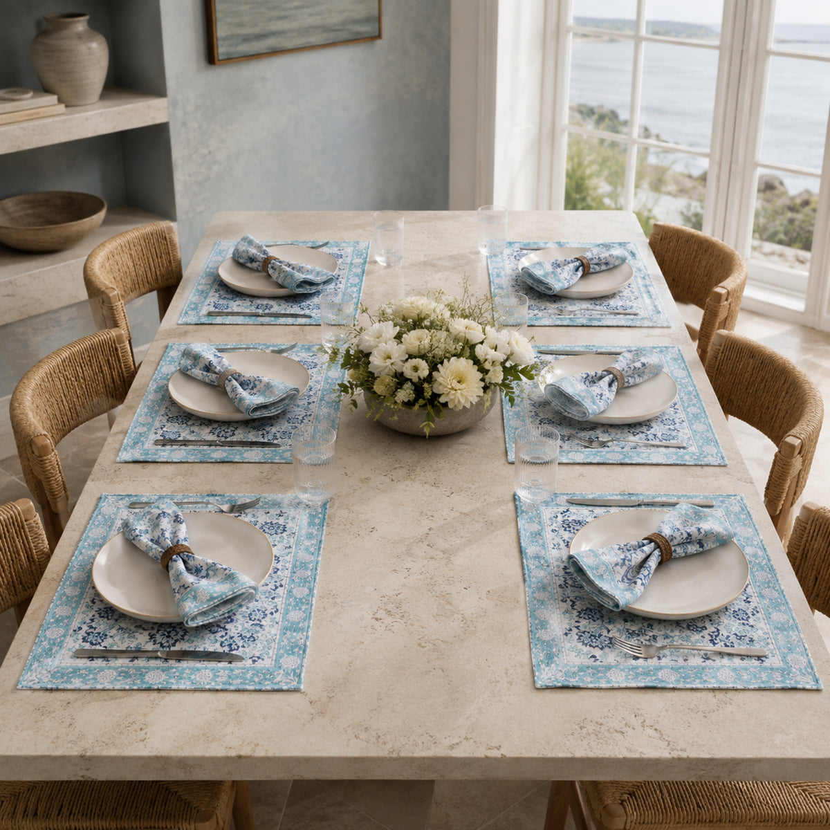 Sky Blue Floral Mat & Napkin Set, styled on a dining table.
