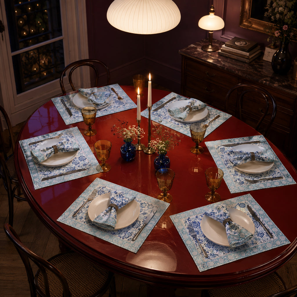 Sky Blue Floral Mat & Napkin Set, styled on a dining table.