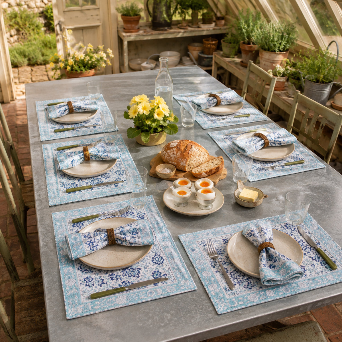Sky Blue Floral Mat & Napkin Set, styled on a dining table.