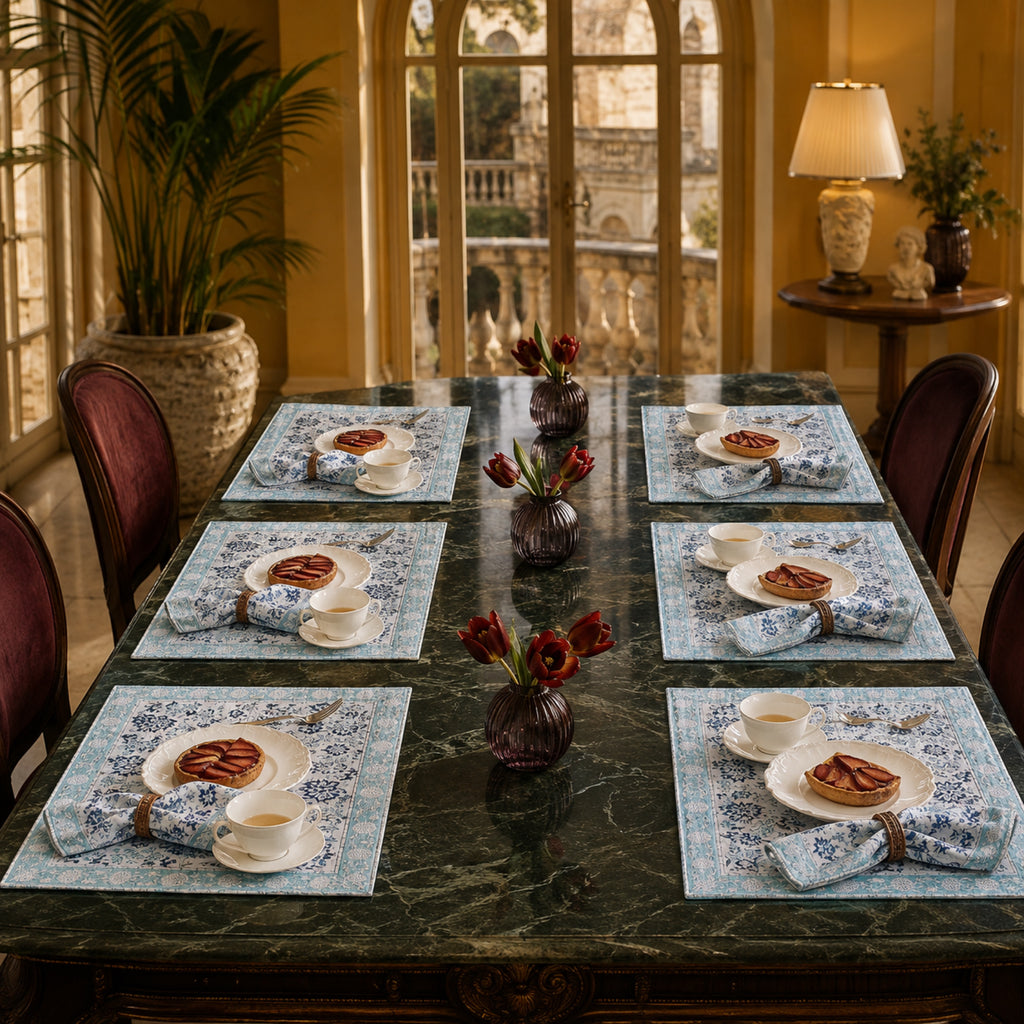 Sky Blue Floral Mat & Napkin Set, styled on a dining table.