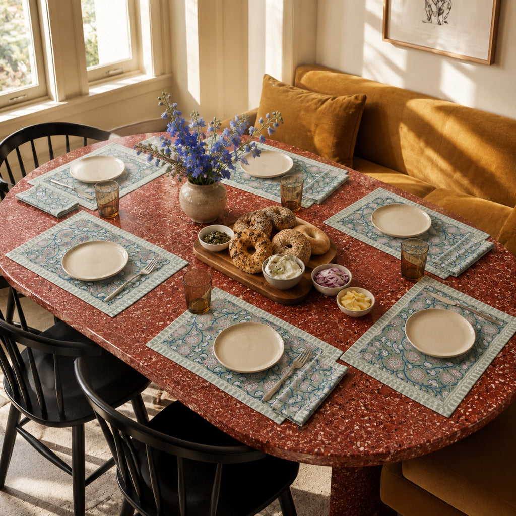 Sage Pom-Pom Floral Mat & Napkin Set, styled on a dining table.