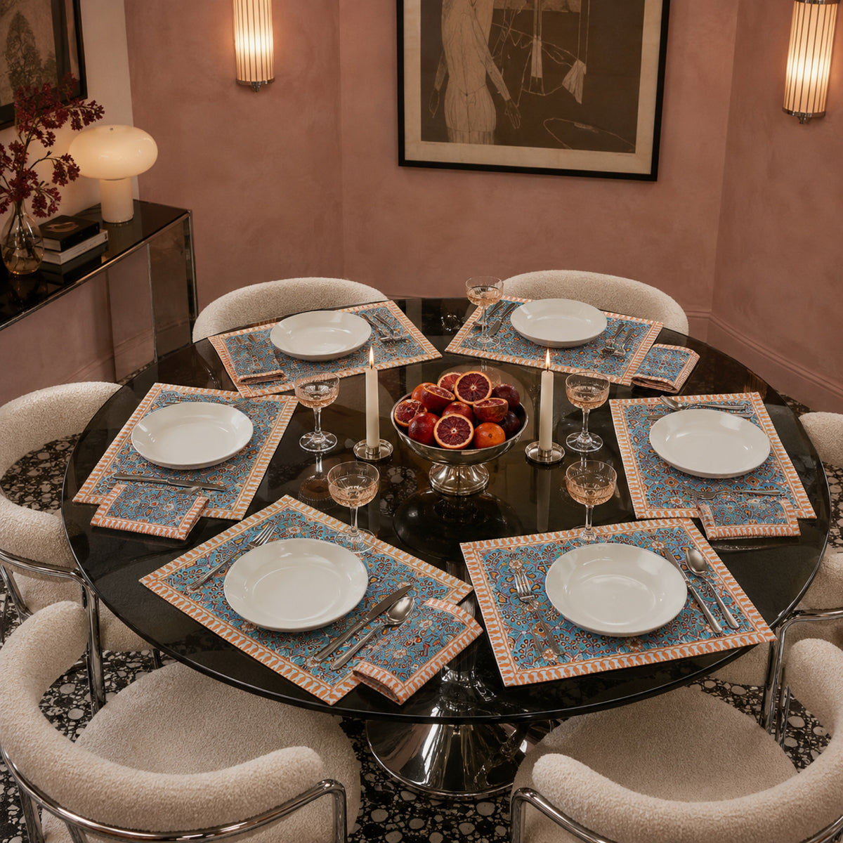 Turquoise Orange Floral Mat & Napkin Set, styled on a dining table.