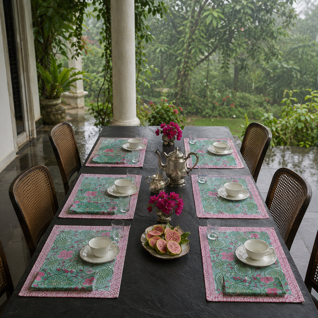 Mint Scroll Floral Mat & Napkin Set, styled on a dining table.