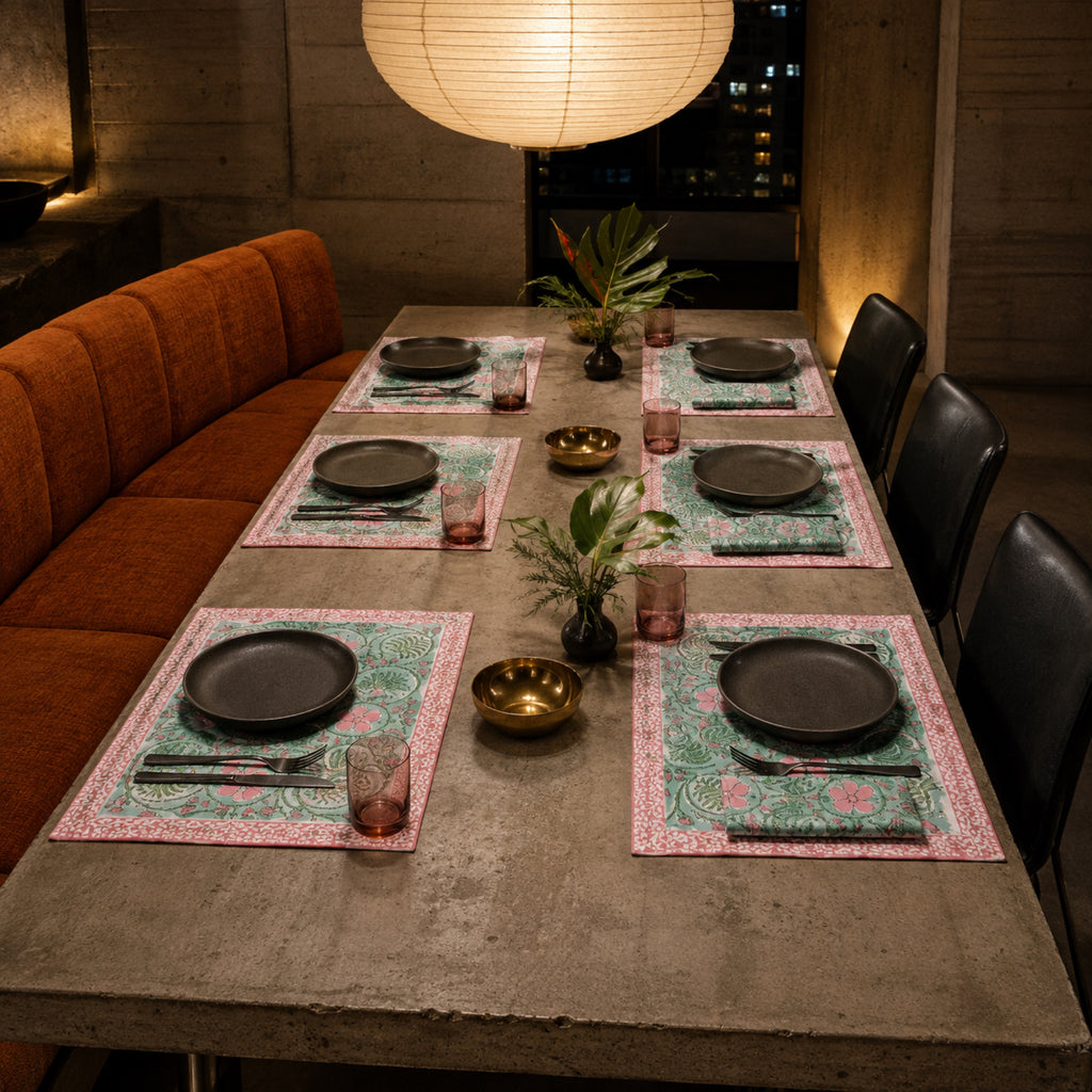 Mint Scroll Floral Mat & Napkin Set, styled on a dining table.