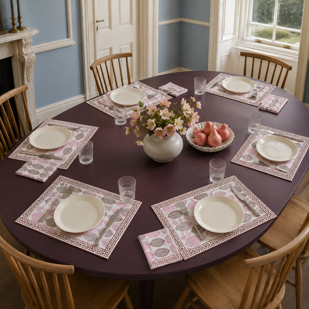 Dusty Pink Leaf Mat & Napkin Set, styled on a dining table.