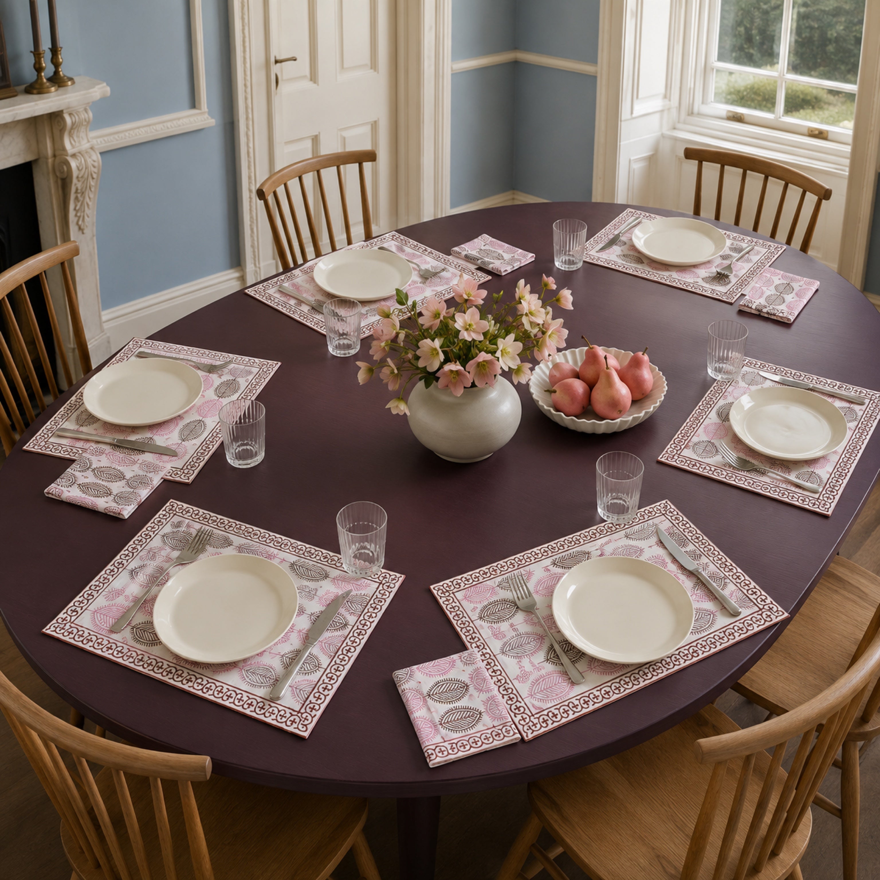 Dusty Pink Leaf Mat & Napkin Set, styled on a dining table.