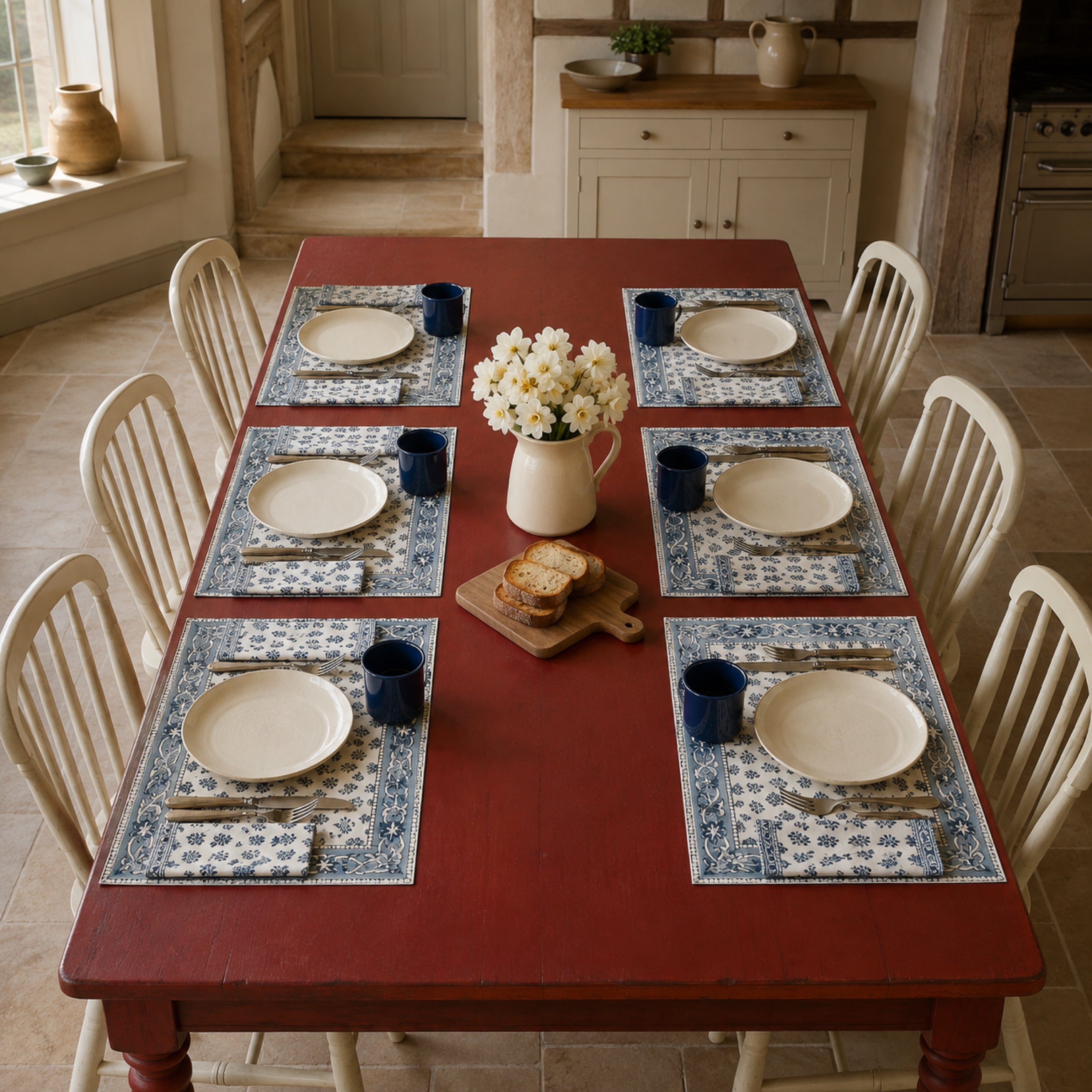 Navy Sprig Denim Border Mat & Napkin Set, styled on a dining table.