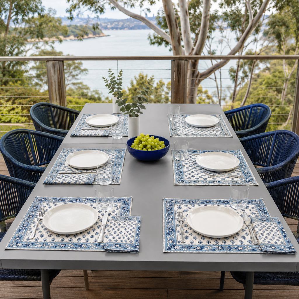 Navy Sprig Denim Border Mat & Napkin Set, styled on a dining table.