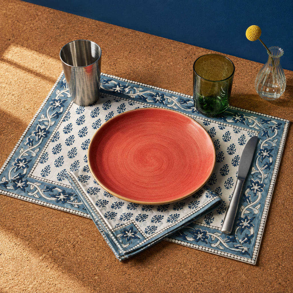 Navy Sprig Denim Border Mat & Napkin Set, styled on a dining table.