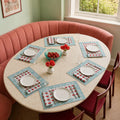 Red Marigold Aqua Border Mat & Napkin Set, styled on a dining table.