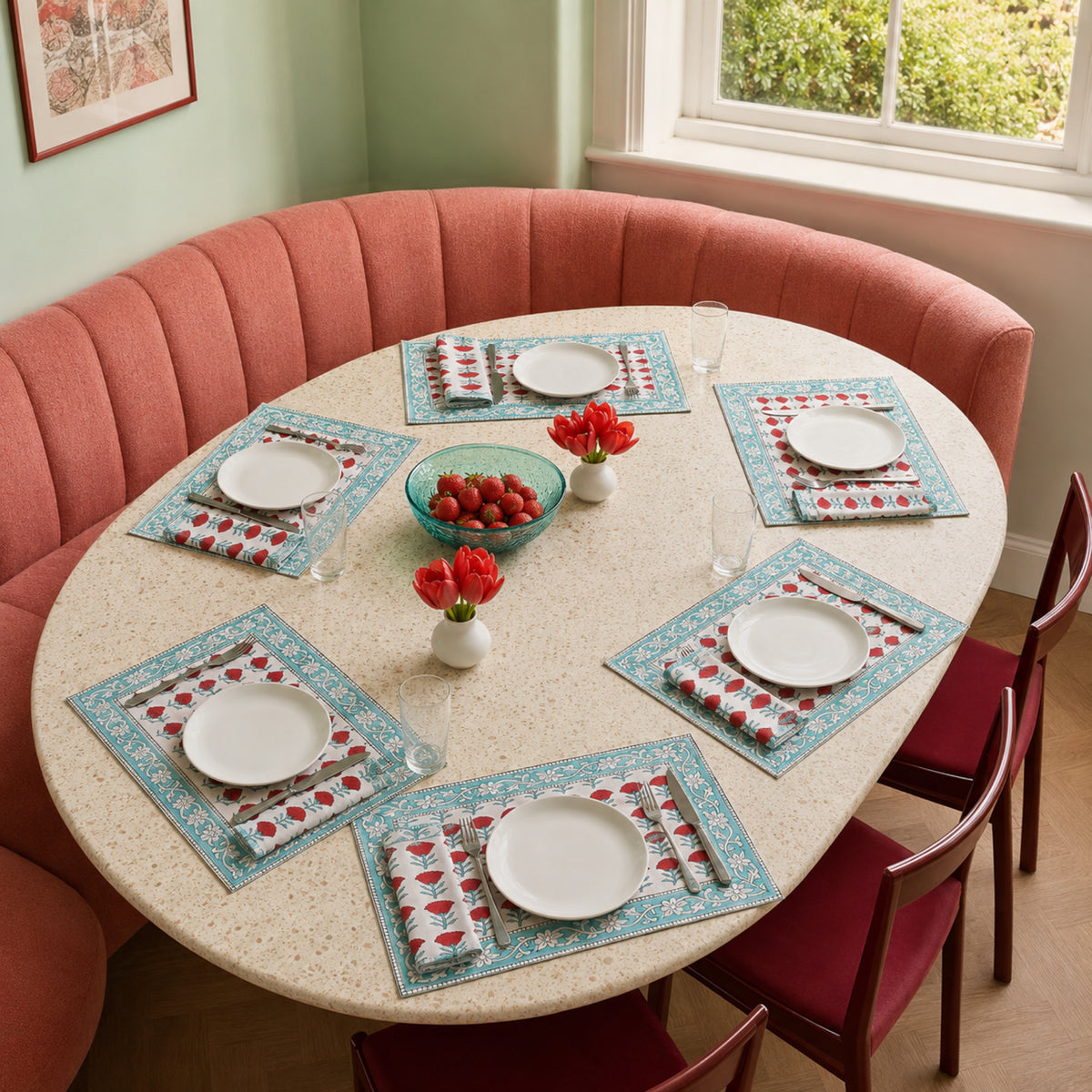 Red Marigold Aqua Border Mat & Napkin Set, styled on a dining table.