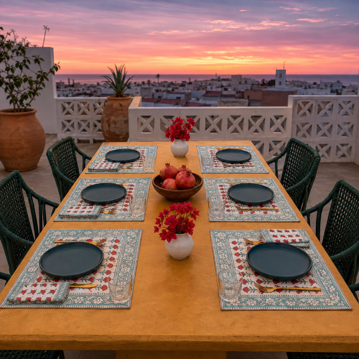 Red Marigold Aqua Border Mat & Napkin Set, styled on a dining table.