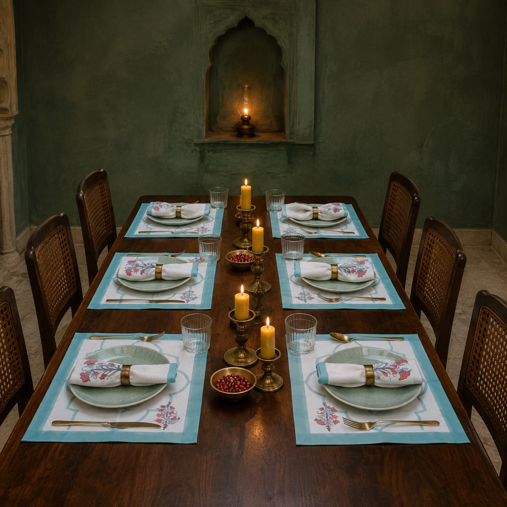 Aqua Scallop Coral Botanical Mat & Napkin Set, styled on a dining table.