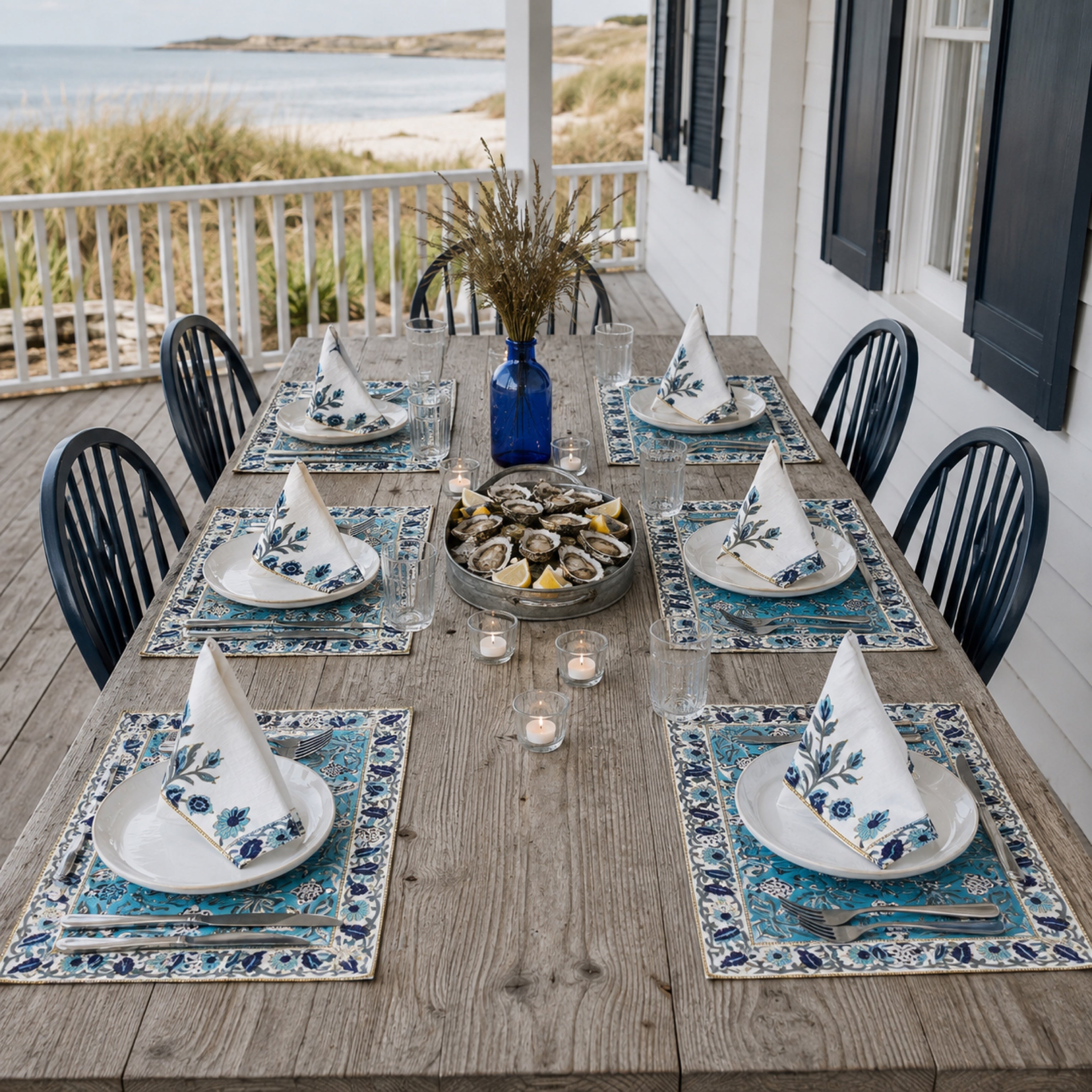 Turquoise Navy Floral Mat & Napkin Set, styled on a dining table.