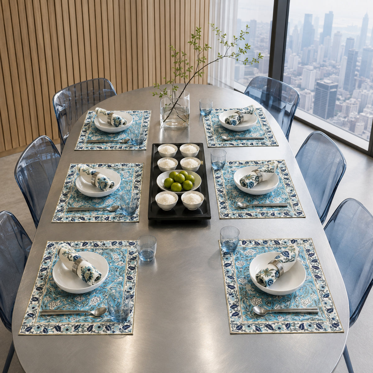 Turquoise Navy Floral Mat & Napkin Set, styled on a dining table.