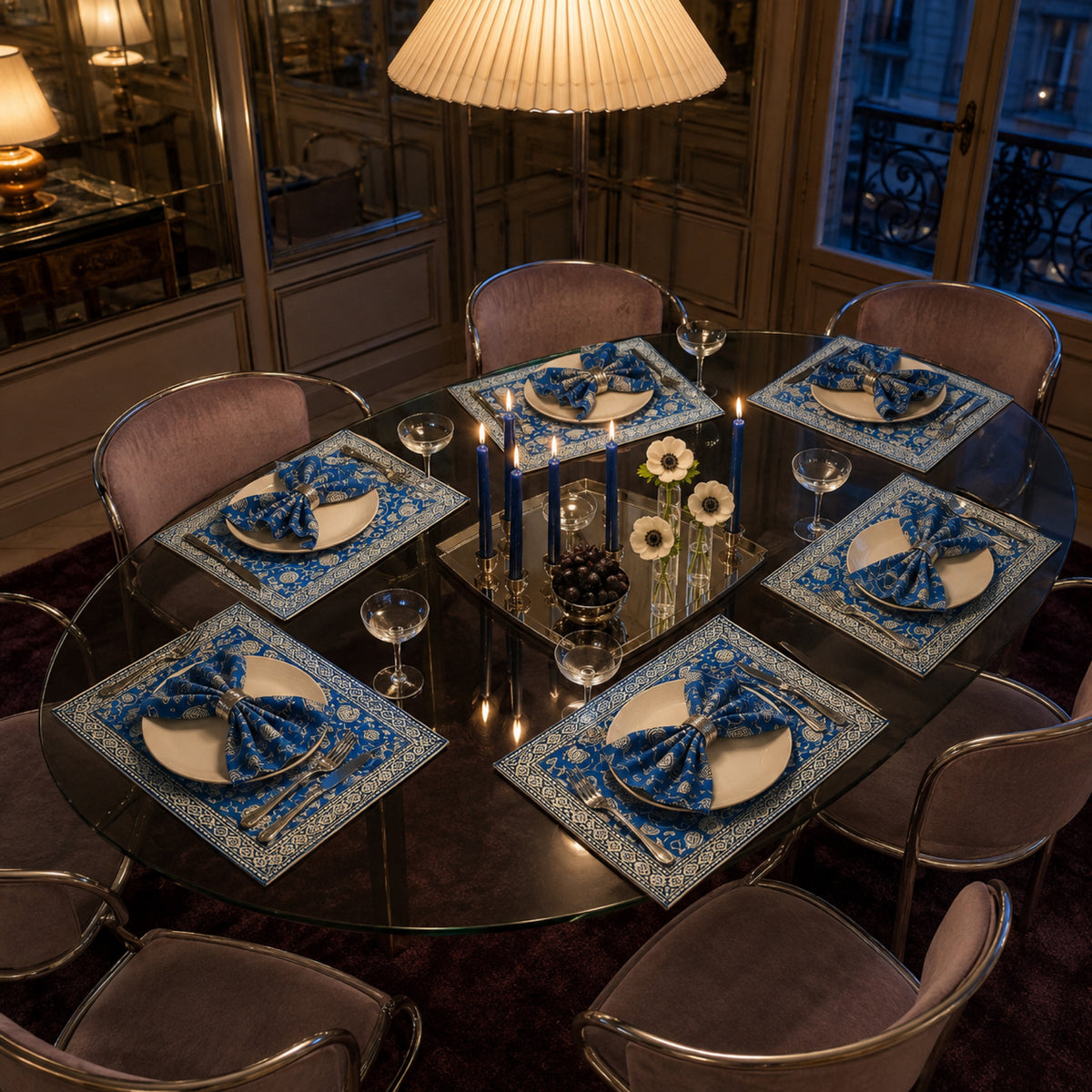 Cobalt Lotus Mat & Napkin Set, styled on a dining table.