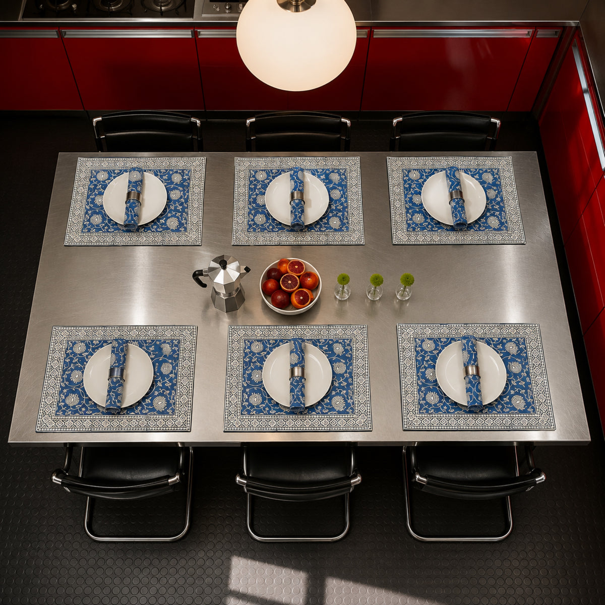 Cobalt Lotus Mat & Napkin Set, styled on a dining table.