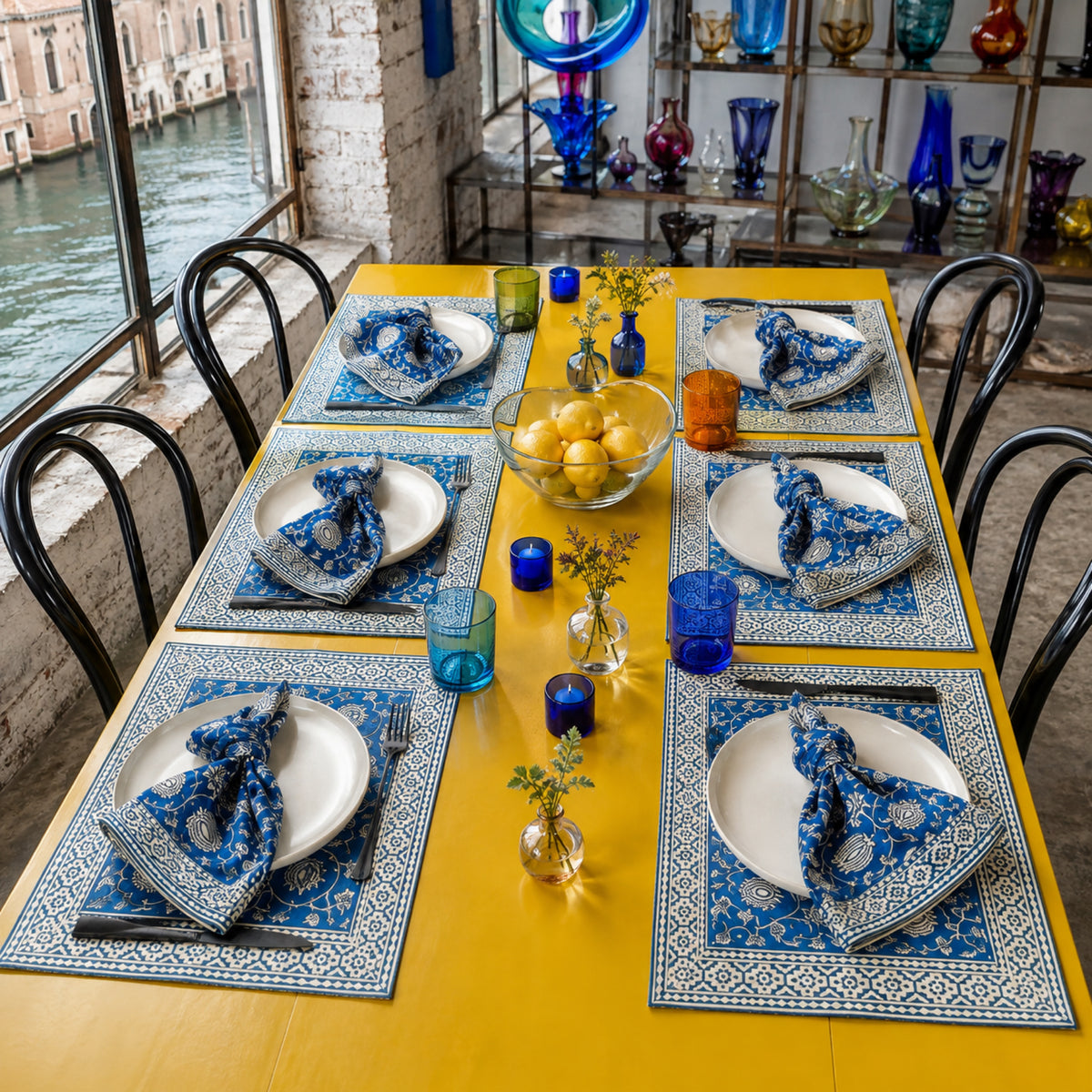 Cobalt Lotus Mat & Napkin Set, styled on a dining table.