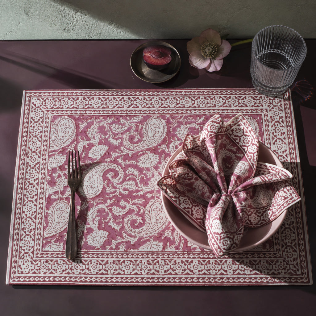 Dusty Rose Paisley Mat & Napkin Set, styled on a dining table.