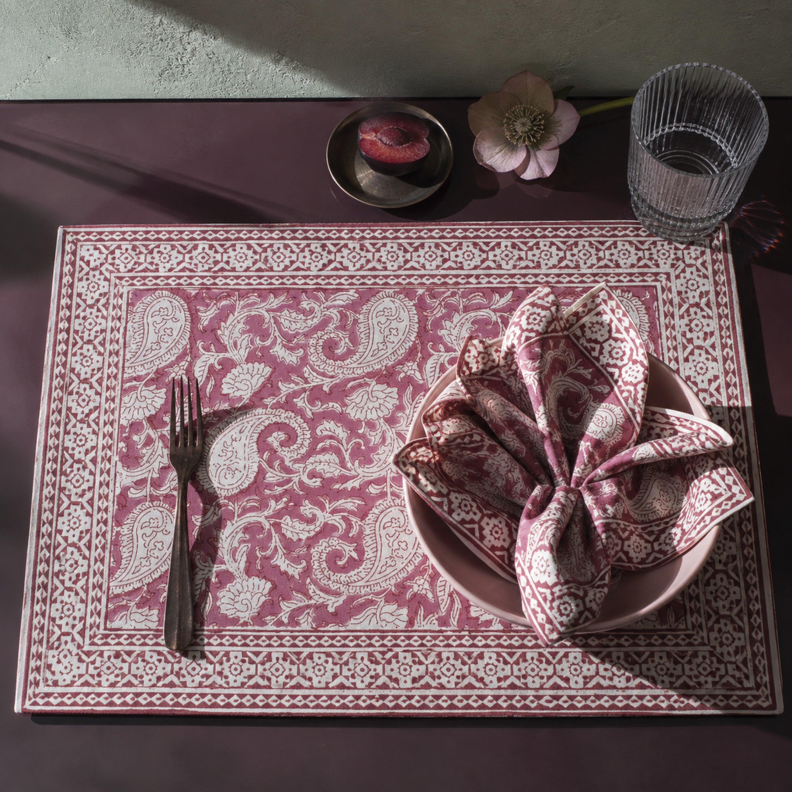 Dusty Rose Paisley Mat & Napkin Set, styled on a dining table.