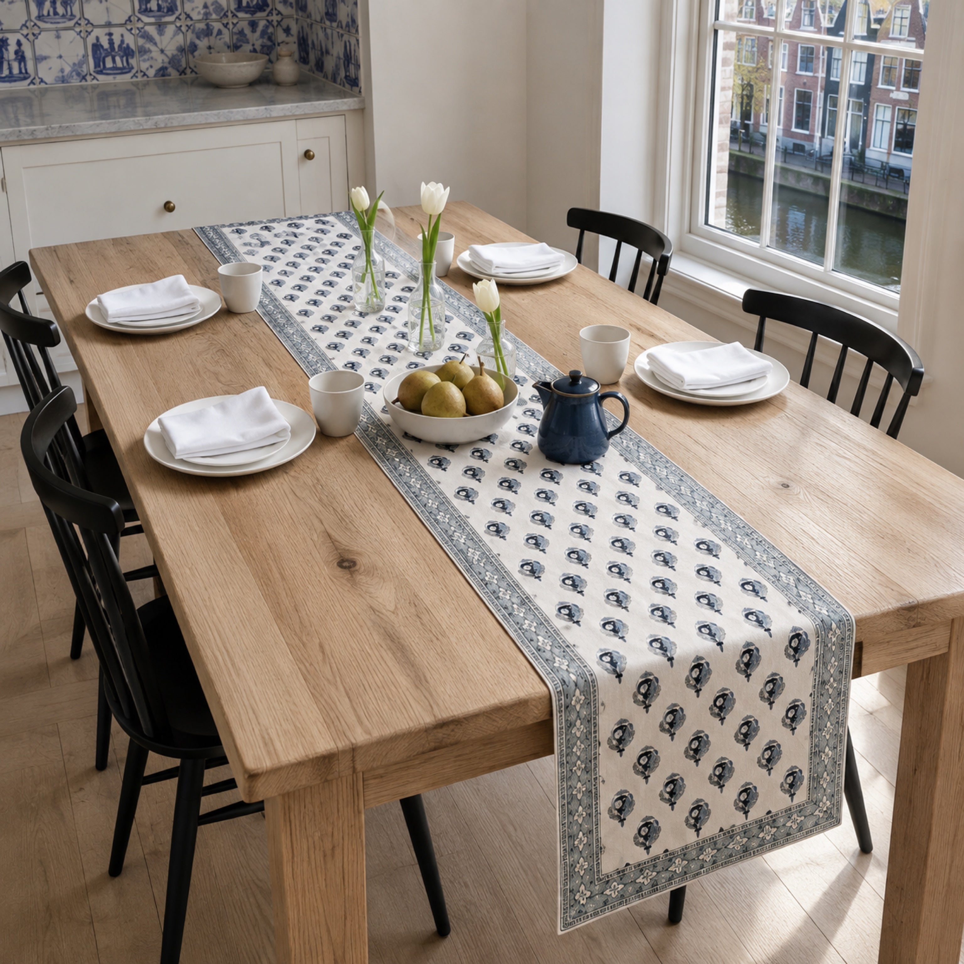 Indigo Bud Blue-Grey Border Table Runner, styled on a dining table.