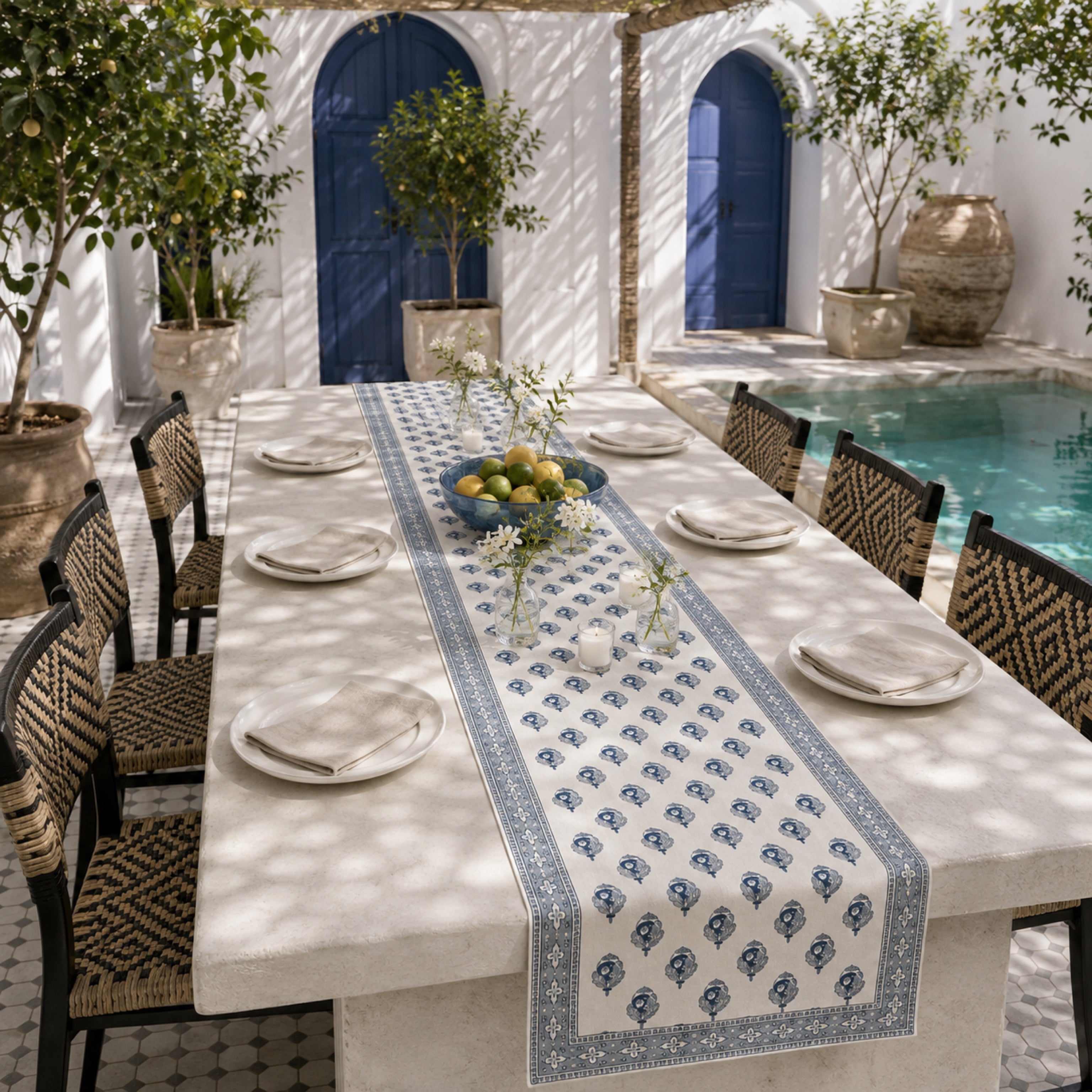 Indigo Bud Blue-Grey Border Table Runner, styled on a dining table.