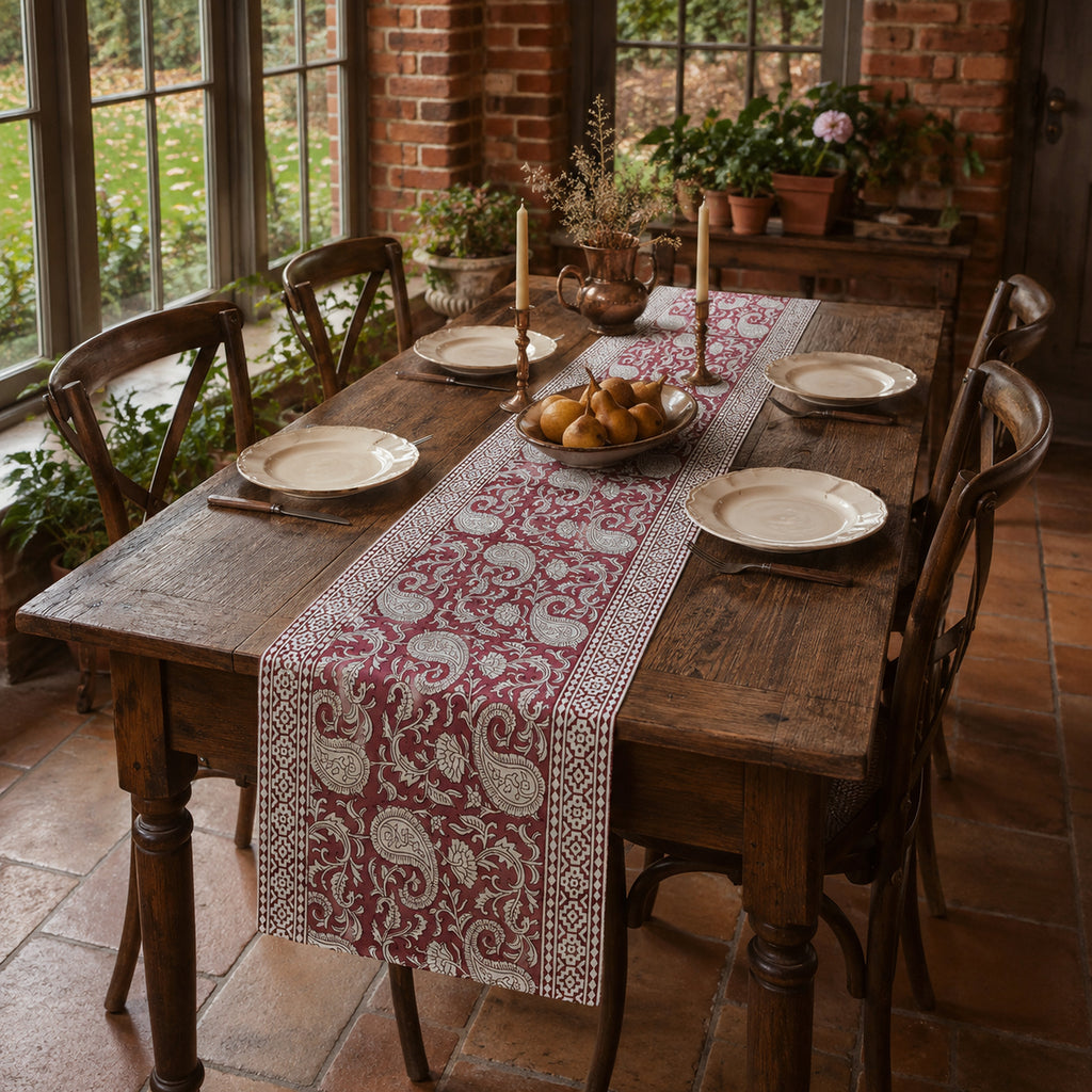 Bordeaux Paisley Vine Table Runner, styled on a dining table.