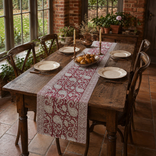 Bordeaux Paisley Vine Table Runner, styled on a dining table.