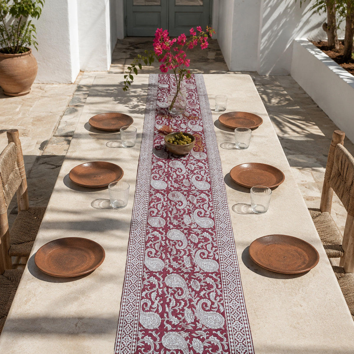 Bordeaux Paisley Vine Table Runner, styled on a dining table.
