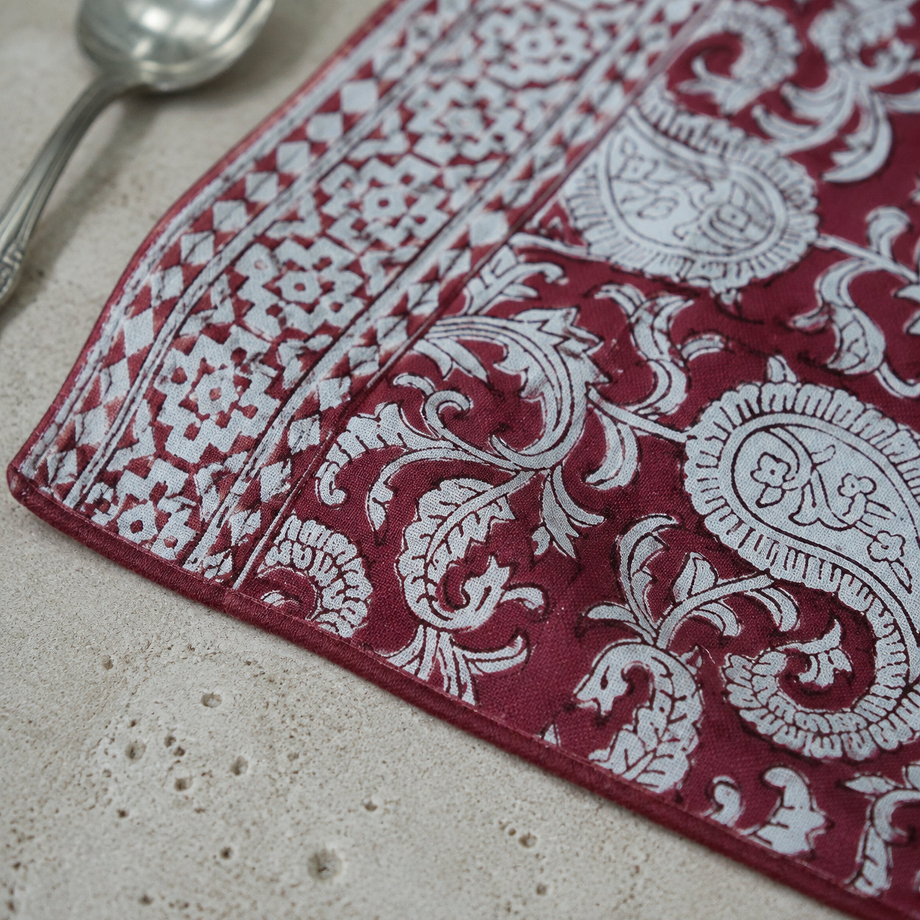 Bordeaux Paisley Vine Table Runner, close-up of the print and edge details.