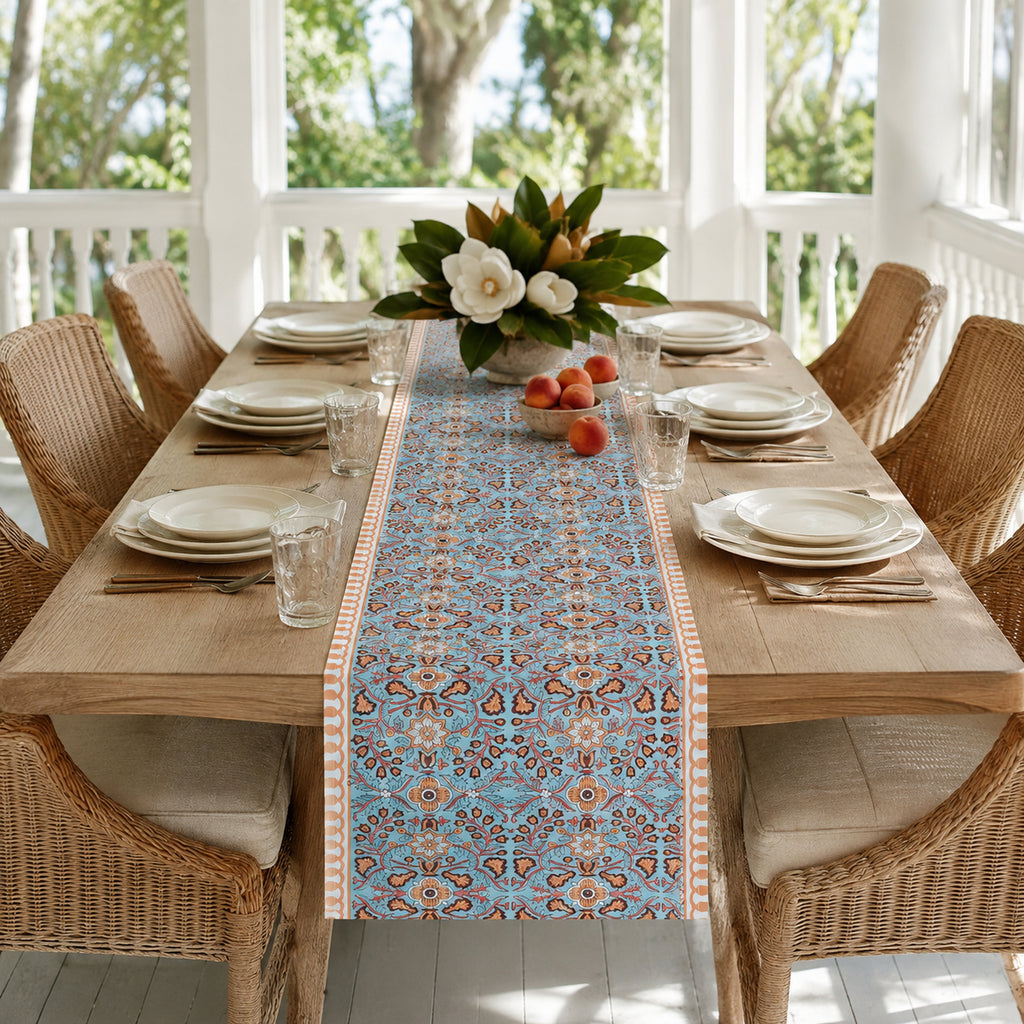 Turquoise Coral Arabesque Table Runner, styled on a dining table.