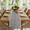 Turquoise Coral Arabesque Table Runner, styled on a dining table.