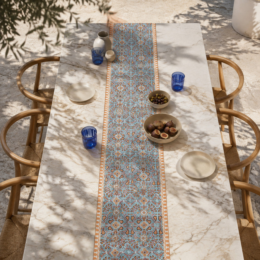 Turquoise Coral Arabesque Table Runner, styled on a dining table.