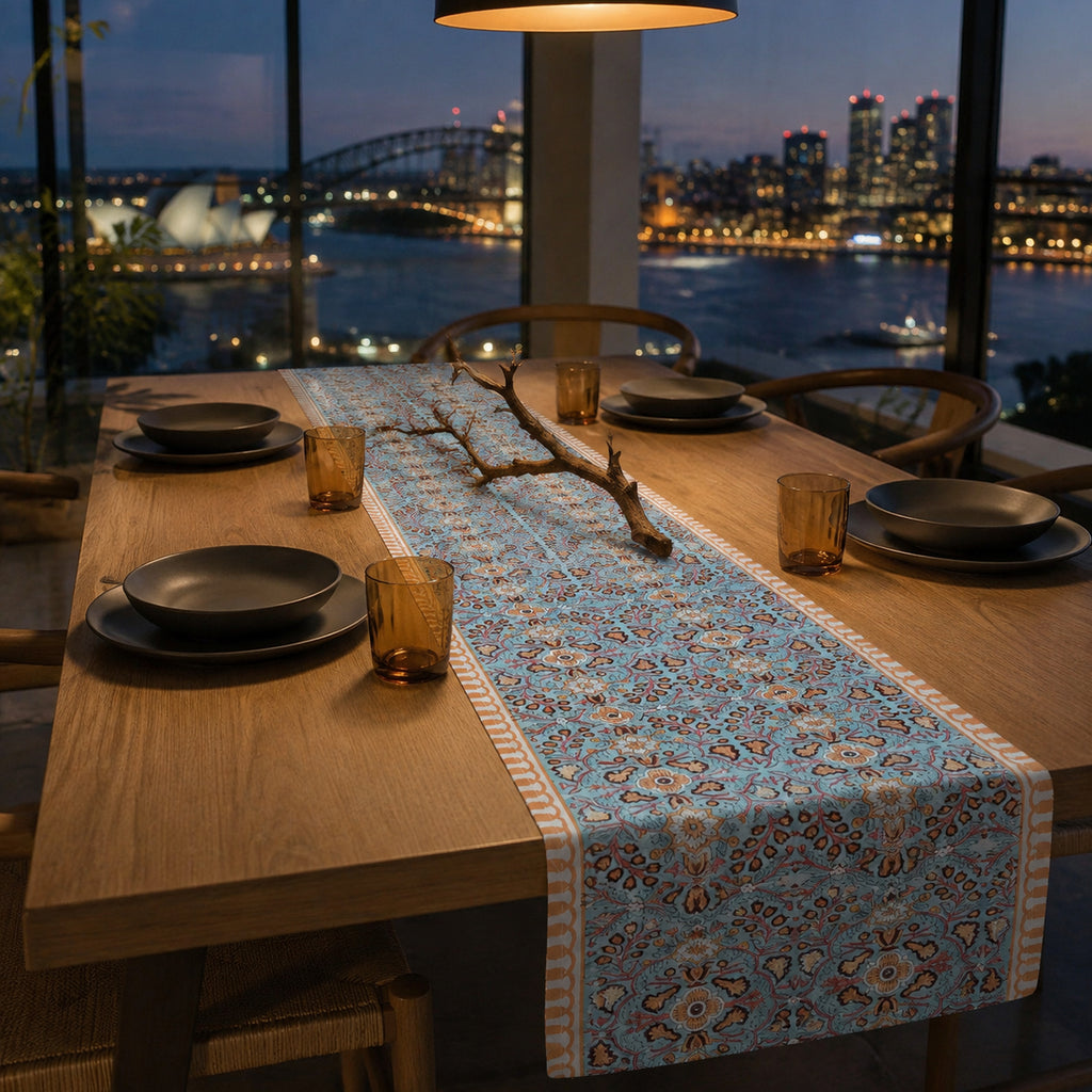 Turquoise Coral Arabesque Table Runner, styled on a dining table.