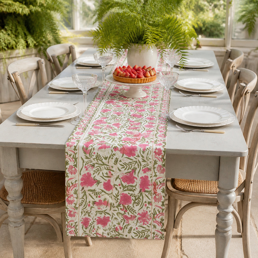 Pink Tulip Garden Table Runner, styled on a dining table.