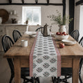 Red Border Mini Floral Table Runner, styled on a dining table.