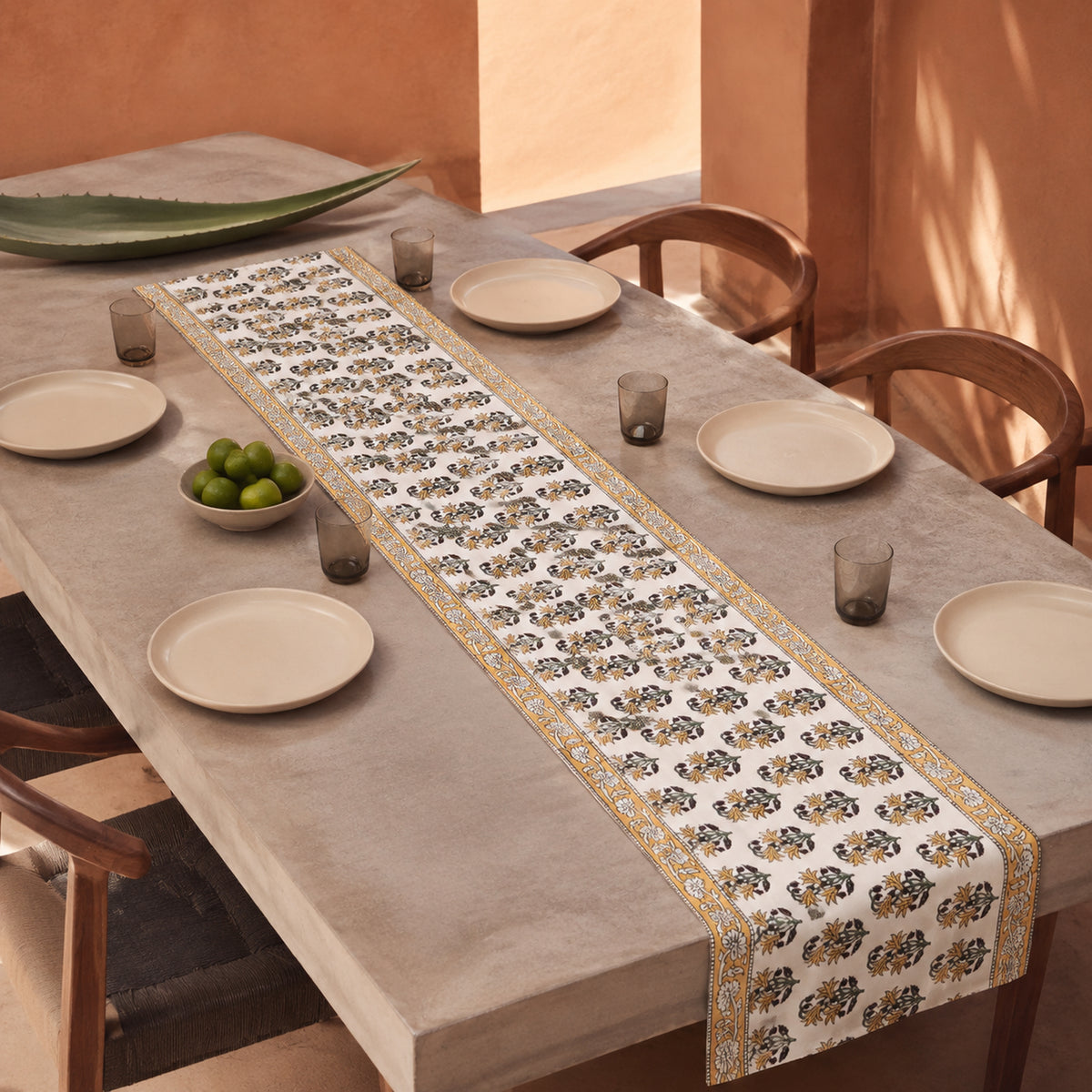 Ochre Border Marigold Table Runner, styled on a dining table.