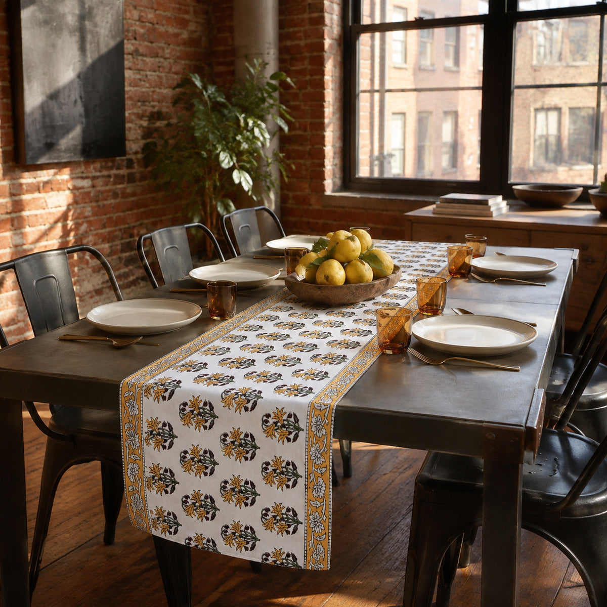 Ochre Border Marigold Table Runner, styled on a dining table.