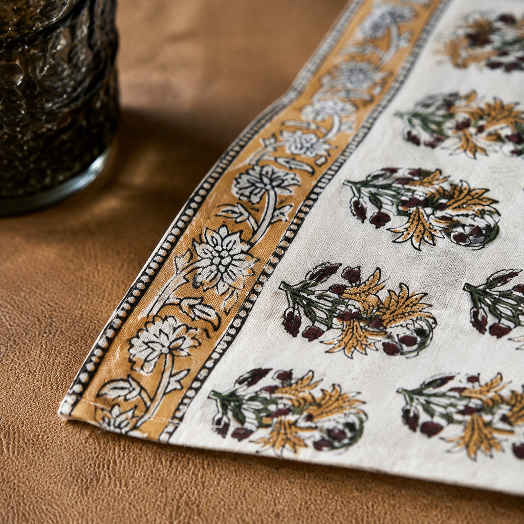 Ochre Border Marigold Table Runner, close-up of the print and edge details.