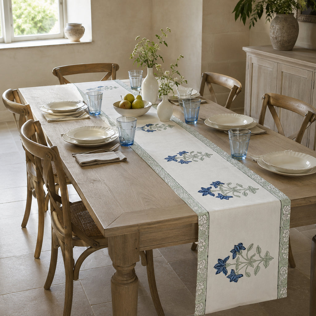 Blue Lily Sage Border Table Runner, styled on a dining table.